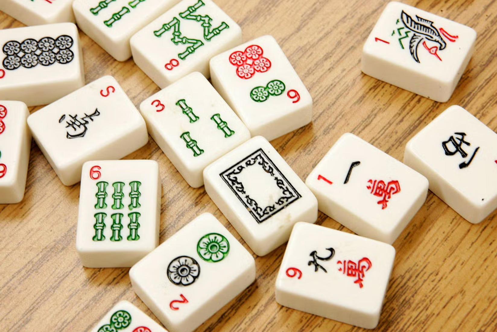 Mahjong tiles arranged on a wooden table